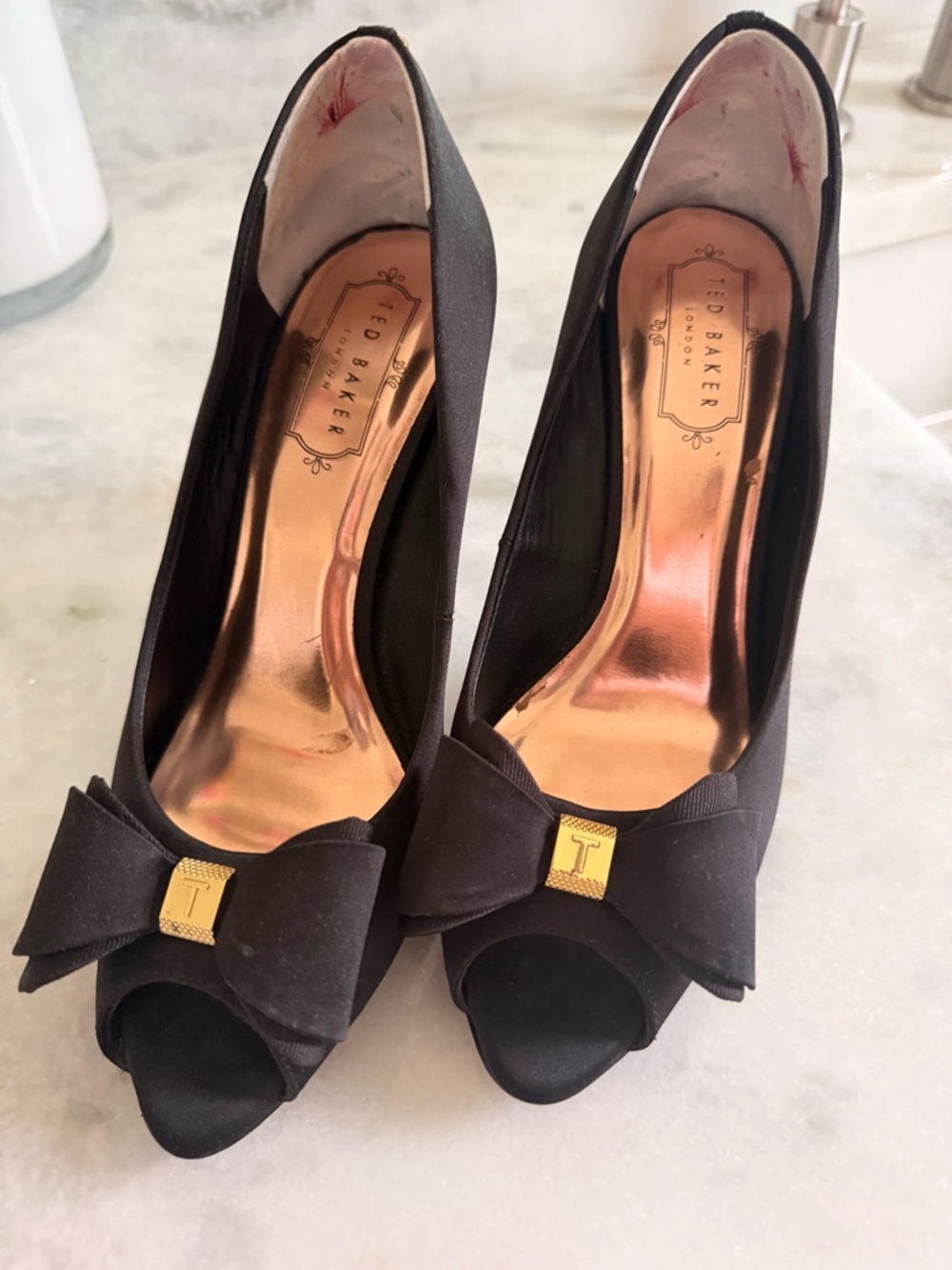 Ted Baker London Black Peep-Toe Bow Heels with Gold Accent